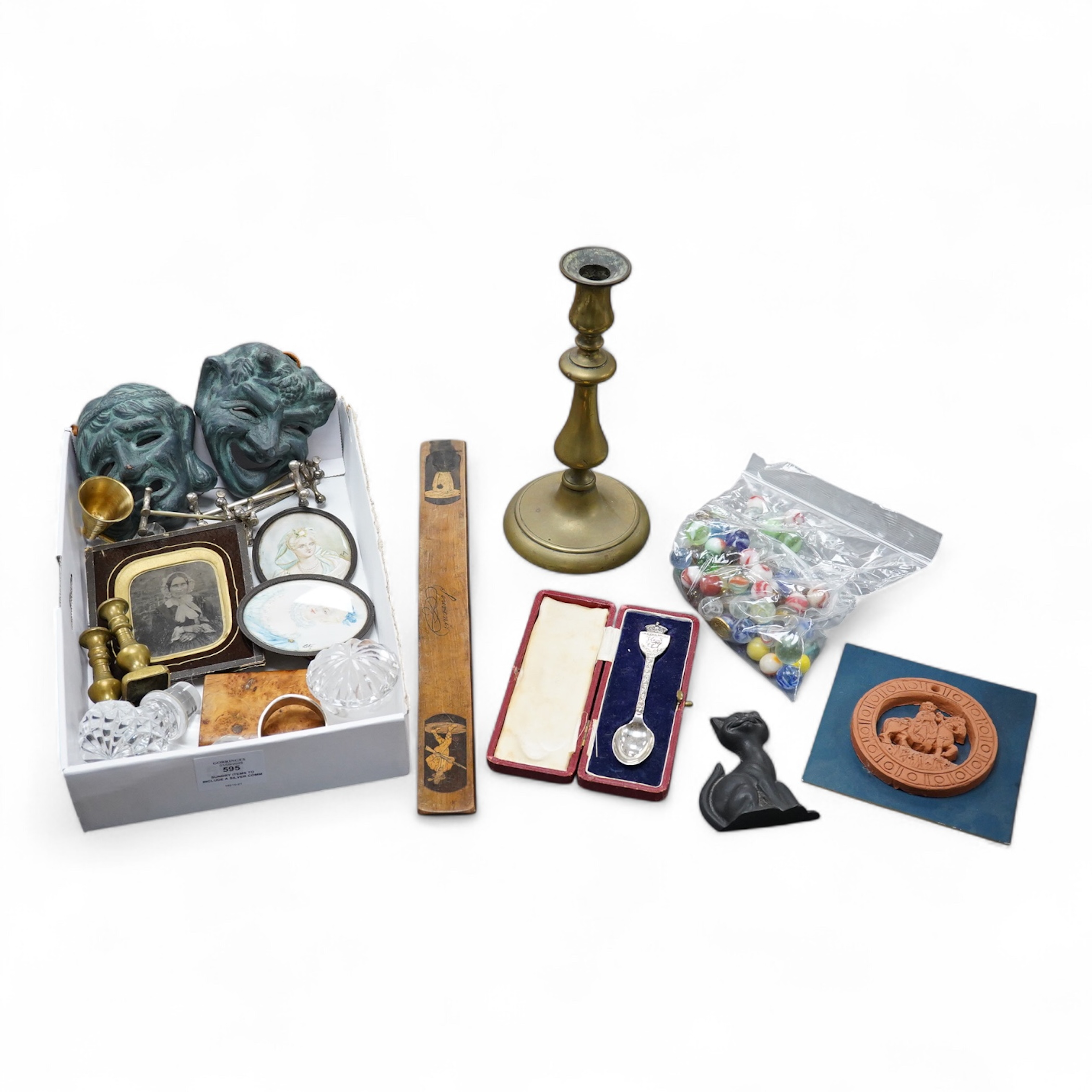 Sundry items to include a silver commemorative spoon, collection of marbles, brass candlestick and a souvenir treen ruler